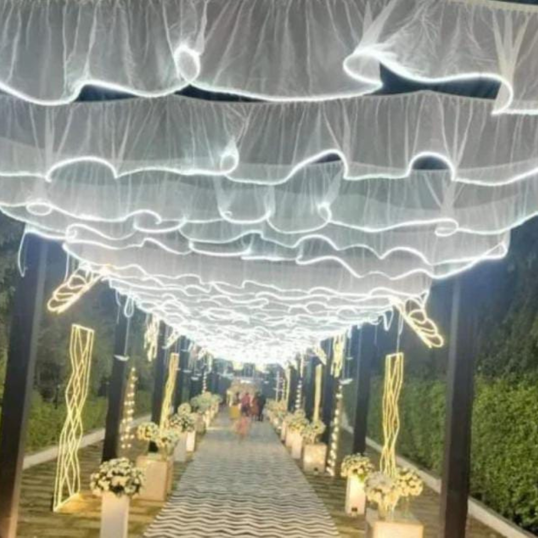 The unique S-shaped wave design Wedding Ceiling adds a touch of elegance and romance to the wedding stage, creating a dreamy and romantic atmosphere. This wedding decorative LED ceiling is available in a variety of colors, allowing you to choose the perfect color to match your wedding theme and style.