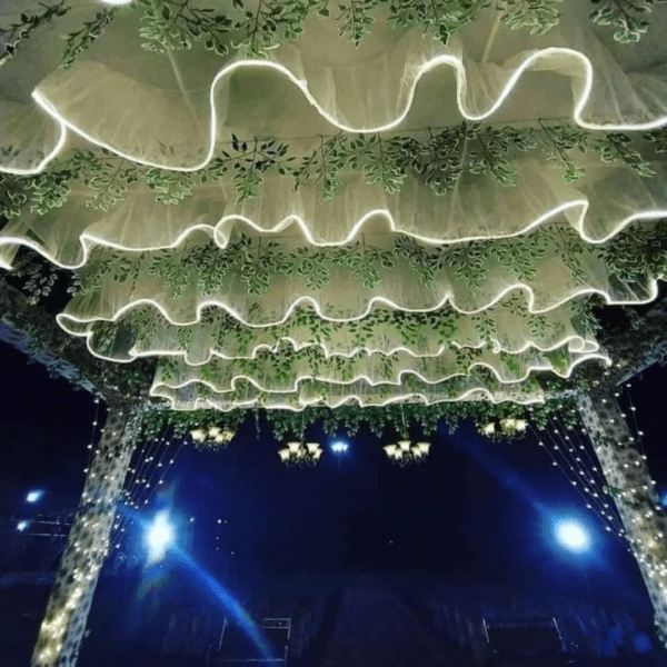 The unique S-shaped wave design Wedding Ceiling adds a touch of elegance and romance to the wedding stage, creating a dreamy and romantic atmosphere. This wedding decorative LED ceiling is available in a variety of colors, allowing you to choose the perfect color to match your wedding theme and style.