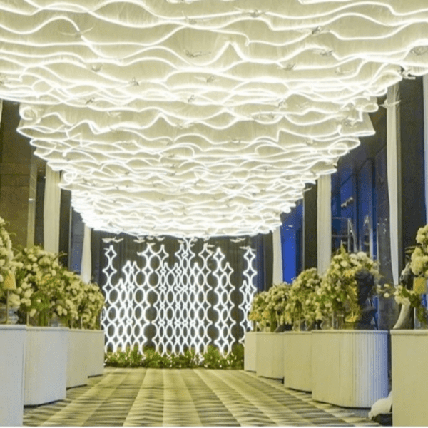 The unique S-shaped wave design Wedding Ceiling adds a touch of elegance and romance to the wedding stage, creating a dreamy and romantic atmosphere. This wedding decorative LED ceiling is available in a variety of colors, allowing you to choose the perfect color to match your wedding theme and style.