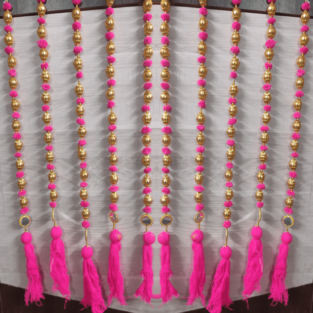 Multi color Pom-poms Handmade strings with golden gotta ball, mirror & tassels Hanging strings/garlands/torans/wall hangings are best choice for decoration ( 3 Feet) Made in India. Beautiful wall hanging Toran for home decoration. It can be used to decorate pooja room, home entrance door, can be hung like Toran in any design. It can be used for decoration of hall, living room or drawing room, balcony and garden also. A beautiful home decor for any function, pooja, marriage ceremony, engagement, or festivals such as diwali, dusshera, Ganesh Chaturthi Wedding Theme Party Props etc. The wall hanging torans are long lasting and can be easily washed and reused. You can hang it anywhere on your doorway, main door, railings, on the sides of mirror etc. It adds the touch of Tradition to the interiors of your house. Length of the strings is 3 Feet.