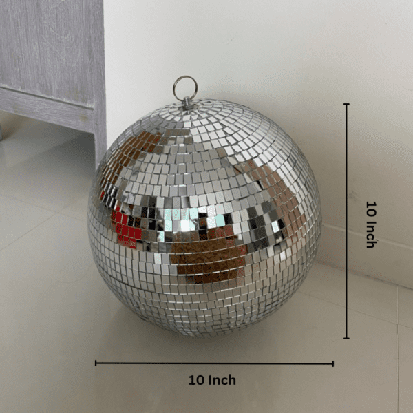 disco ball is a round object with a mirrored surface that reflects light in many directions, creating a complex display. The ball is usually pendent from the ceiling and rotates to cast reflected light on the surrounding surfaces. The surface of a disco ball is made up of hundreds or thousands of small, mirrored facets that are almost all the same size and shape When light reflects off these mirrors, it scatters in many directions, producing a unique effect. The rotation of the mirror globe creates a profusion of moving spots.