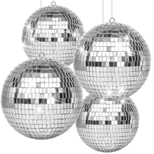 The hanging mirror ball surface is covered with tiny mirrored squares, which can reflect light on the room. Disco ball is a round object with a mirrored surface that reflects light in many directions, creating a complex display. The ball is usually pendent from the ceiling and rotates to cast reflected light on the surrounding surfaces. The surface of a disco ball is made up of hundreds or thousands of small, mirrored facets that are almost all the same size and shape. When light reflects off these mirrors, it scatters in many directions, producing a unique effect. The rotation of the mirror globe creates a profusion of moving spots.