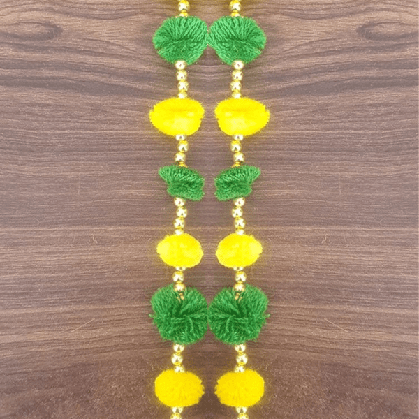 Decorate your home/doors and bring good luck to your home by these Pom Pom Flowers Garlands Torans. Pom Pom can be hanged on doors and can be used on many occasions like Corporate Gifts, Diwali Decorations , Pooja ghar, Festivals, House Warming, Wedding, Parties and inaugurations. Material: Handmade product made up of woolen pom-pom,golden beads, Chakri and golden decorative hanging bells Can be used to create strings. The wall hanging torans are long lasting and can be easily washed and reused. Can be used to create strings' curtains in living area. Looks good as wall hangings, door torans, window backdrops etc.